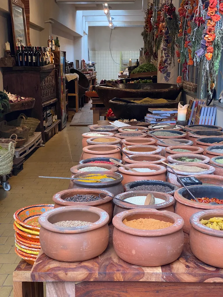 Terracotta pots filled with spices at RAÏNARAÏ