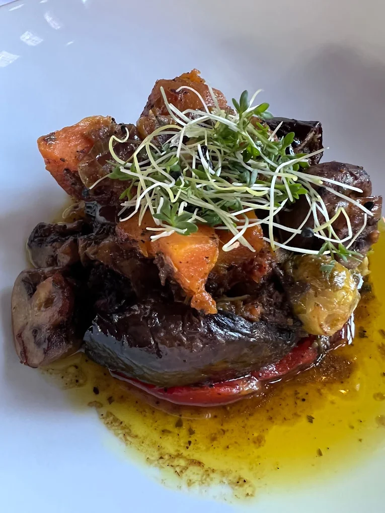 Slow-cooked aubergine with mushrooms and sprouts